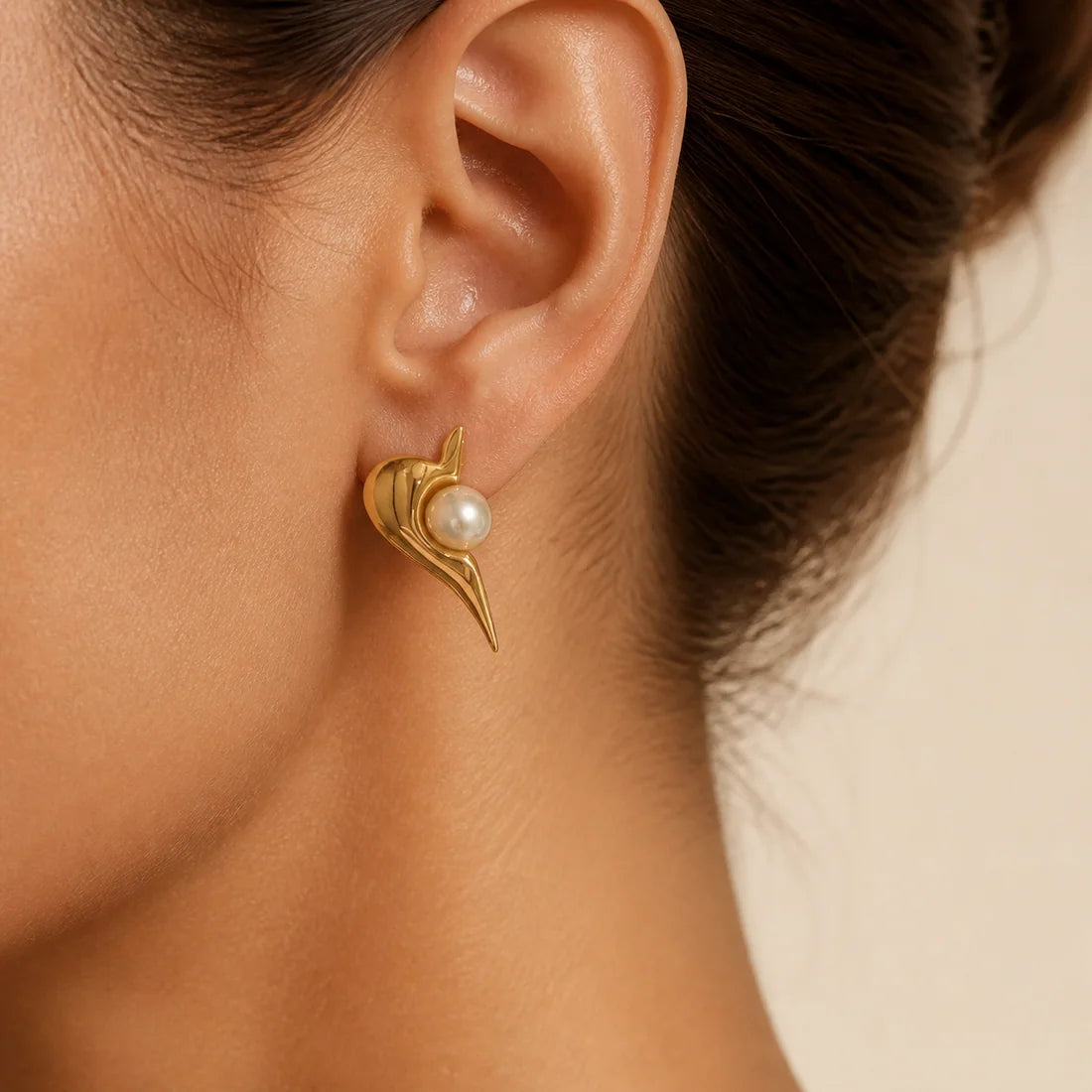 Model wearing the Pearl Flame Stud