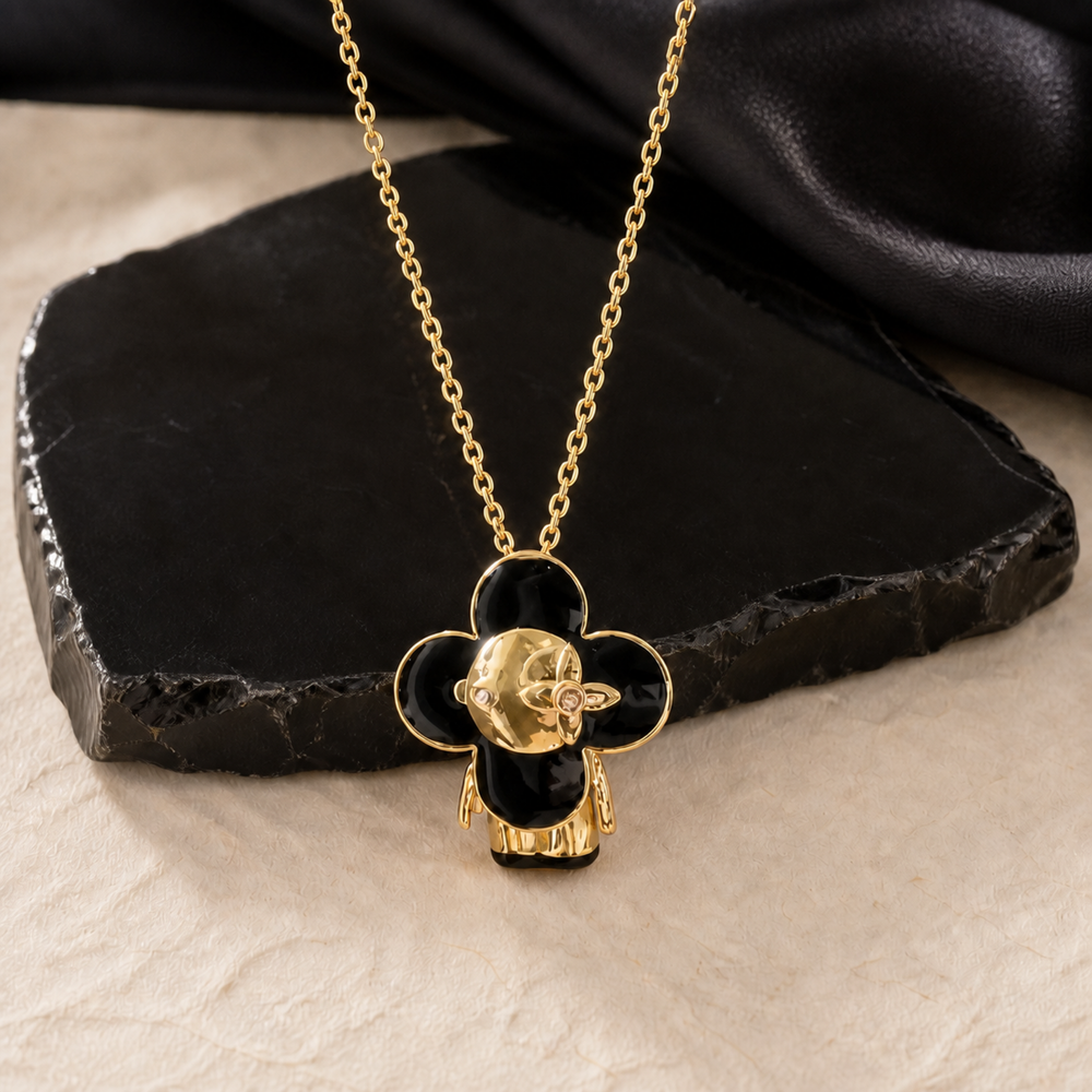 Black enamel face pendant