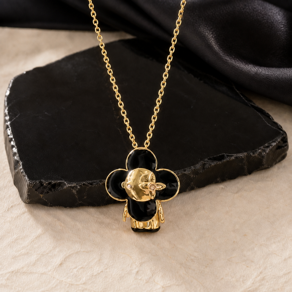 Black enamel face pendant